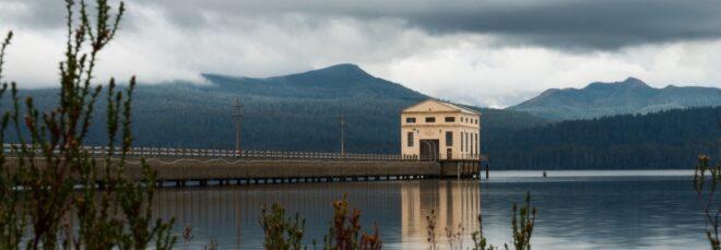 large tan art deco building on a lake