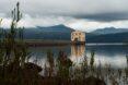 large tan art deco building on a lake