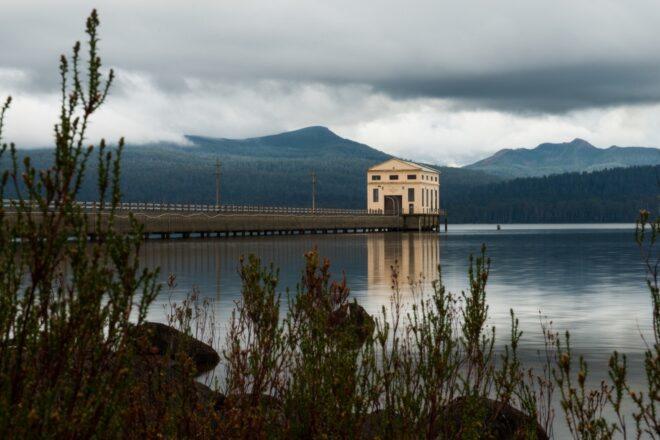 large tan art deco building on a lake