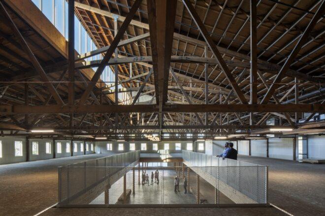 wood-beamed ceiling over open office spaces