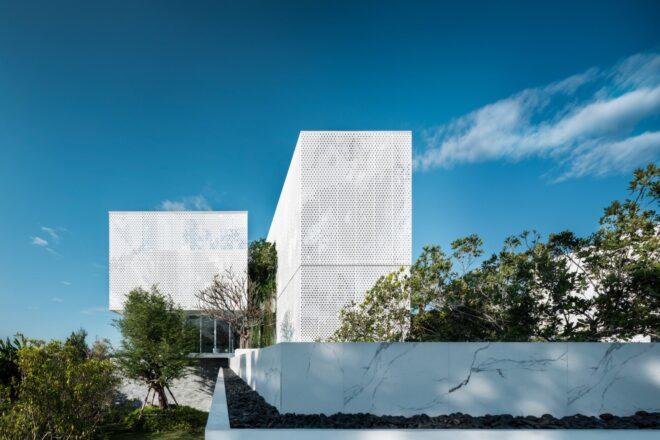 tower-like structure with all white perforated facade