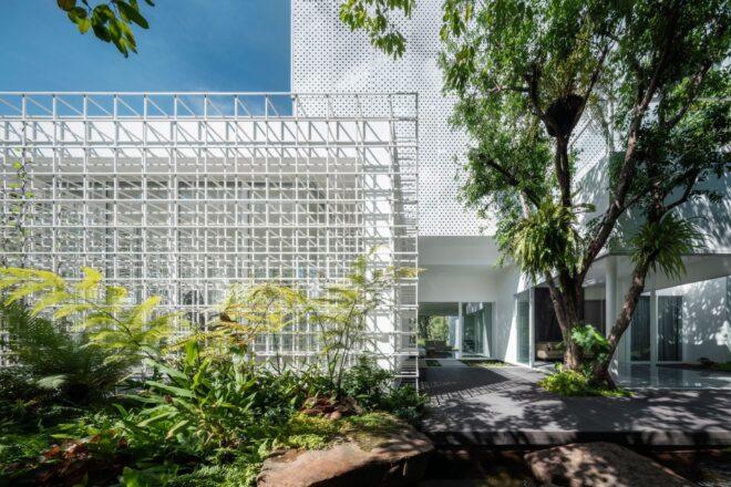 walkway leading to modern home with grid-like facade