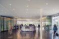 round reception desk in a glass building
