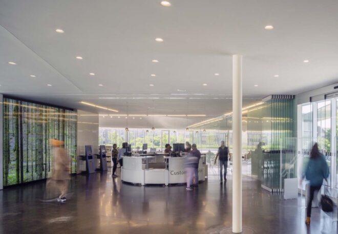 round reception desk in a glass building