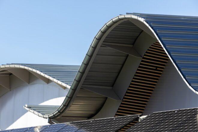 close-up of wavy roof covered in solar panels