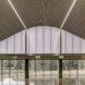 large open room with wavy ceiling and glass walls