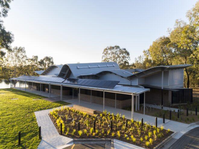 garden beside white building with serpentine roof