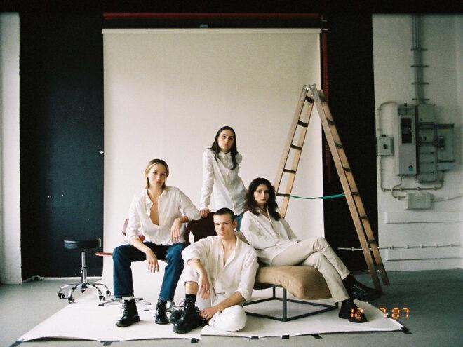 group of people in white button-down shirts