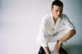 person wearing white jeans and white button-down shirt