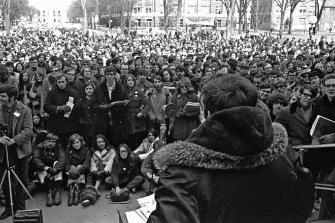 black and white photo of people gathered for an Earth Day protest in 1970