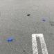 blue and black latex gloves littered in a parking lot