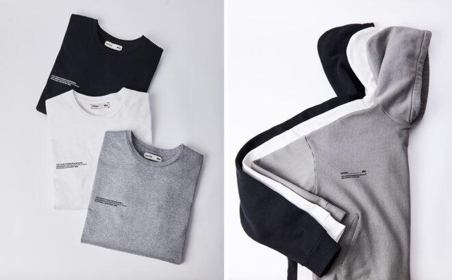 flat lay of folded gray, white and black T-shirts and sweatshirts