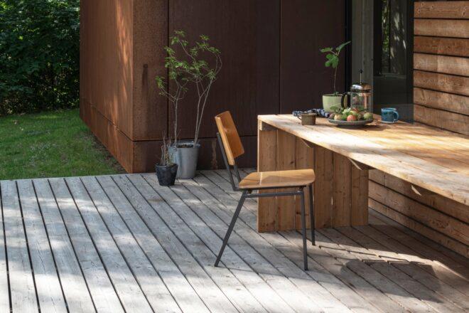 table and chair on an outdoor wooden deck