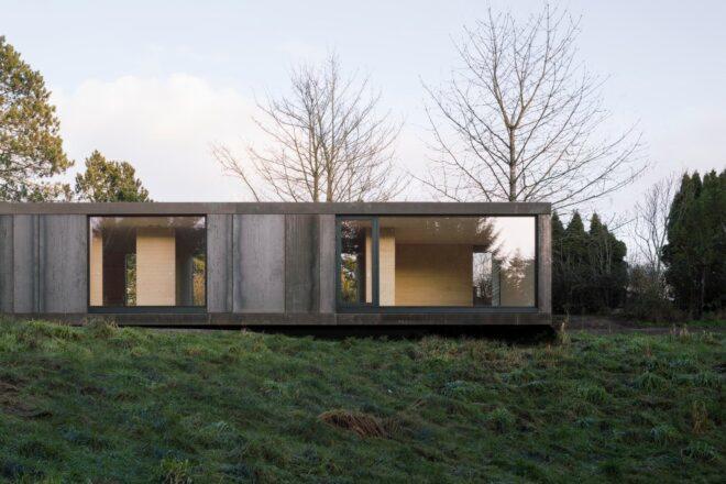elongated home with large floor-to-ceiling glass panels