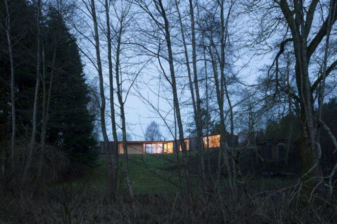 single-story home illuminated at night