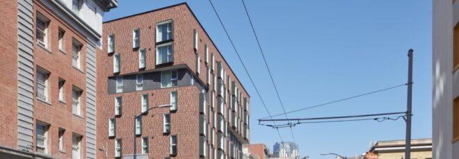 mid-rise brick building on street in San Francisco