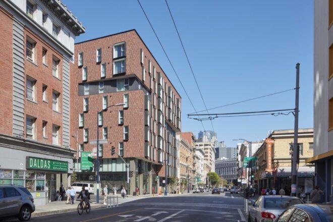 mid-rise brick building on street in San Francisco