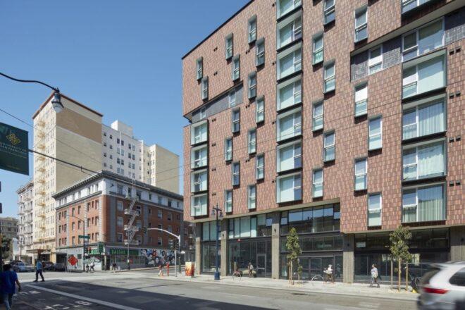 mid-rise brick building with several windows