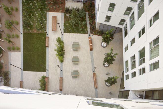 aerial view of courtyard filled with plants and seating areas