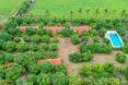 aerial view of cottages with terracotta roofs on a farm