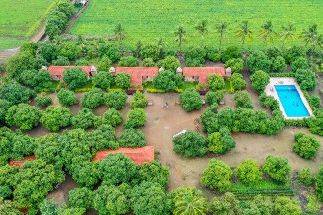 aerial view of cottages with terracotta roofs on a farm