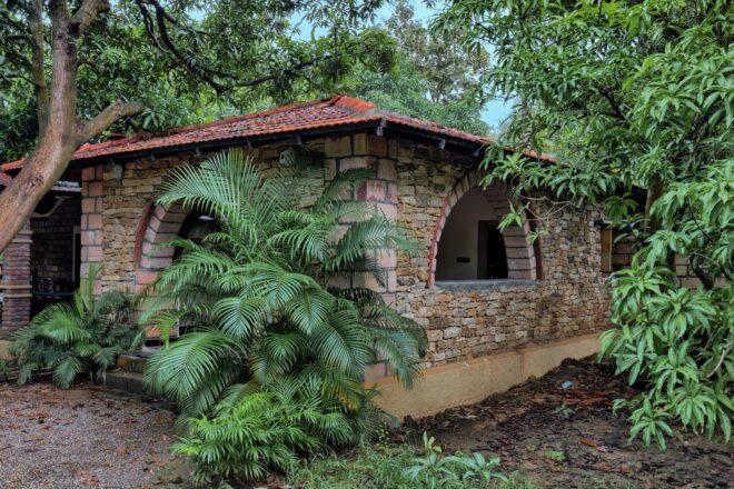 stone home with terracotta roofs