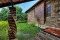 grassy yard beside a brick building with spiral brick columns