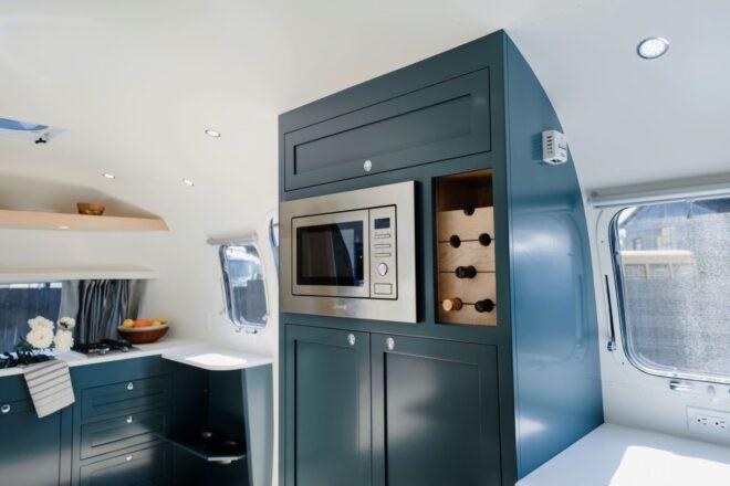 modern kitchen with dark green cabinets