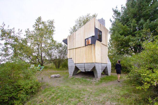 Angular cabin clad in ash wood