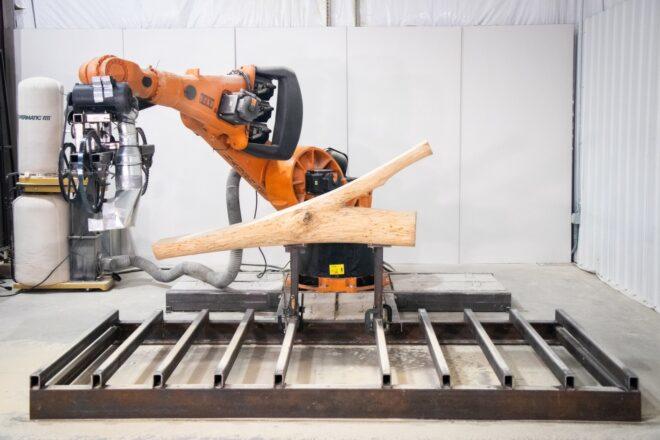 machine slicing a tree log