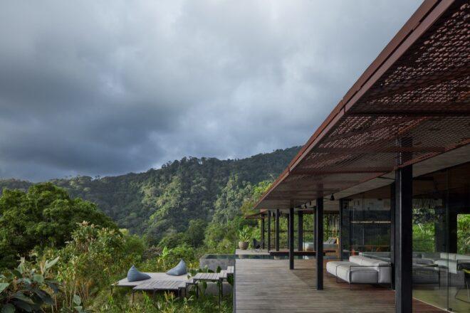 white outdoor sofa on a wood balcony