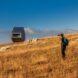 man walking towards a tiny bivouac in the distance