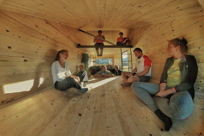 group of people in a tiny wooden space