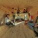 group of people in a tiny wooden space