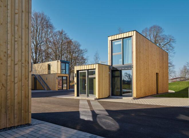 shipping container buildings with timber siding
