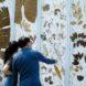 people looking at leaf print wall art
