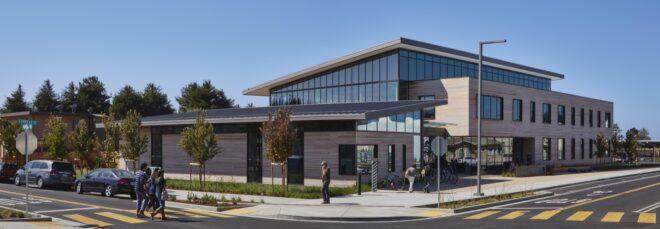 building with dark and light wood facade and a slanted roof
