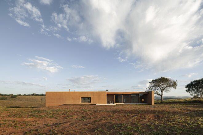 elongated rammed earth home