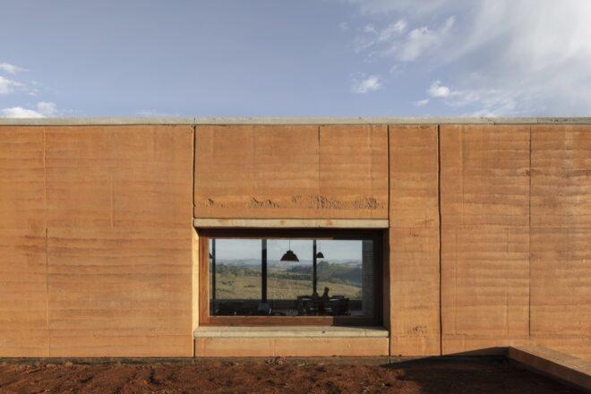 two aligned rectangular windows on opposite sides of a home