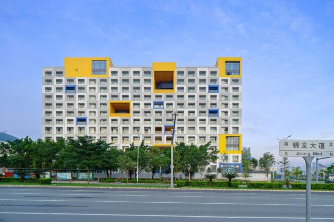 a multi-story building with pops of blue and yellow