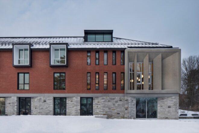 concrete and brick building covered in snow