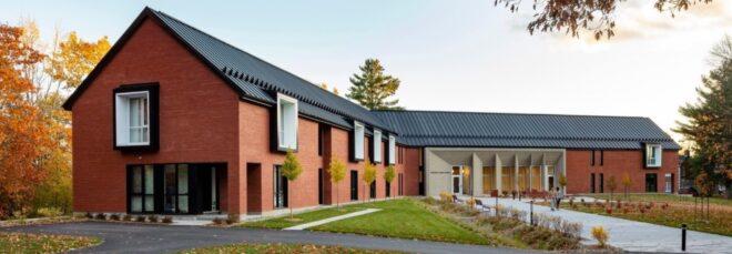 V-shaped brick building with gabled roof