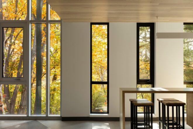 black-framed narrow windows in a white room