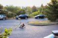 man crouched down riding a skateboard