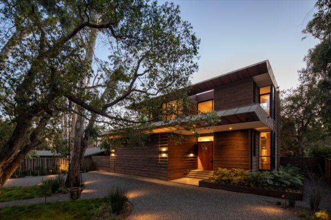 a wood cabin-like structure lit up from the inside