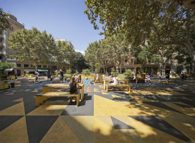 benches in a park with yellow and gray floors