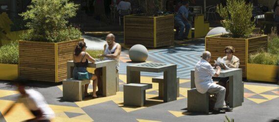 people playing chess in a park