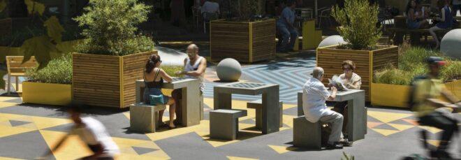 people playing chess in a park