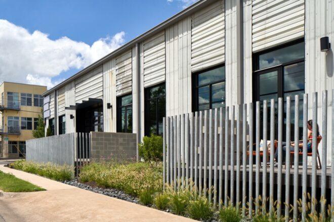 small enclosed patios next to a white building