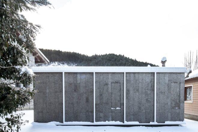 cabin with five sections covered in snow